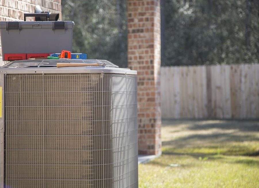 Outdoor air conditioning system with toolbox on top of it
